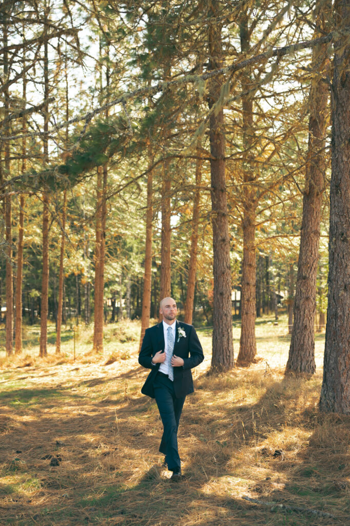 groom walking to the photogapher