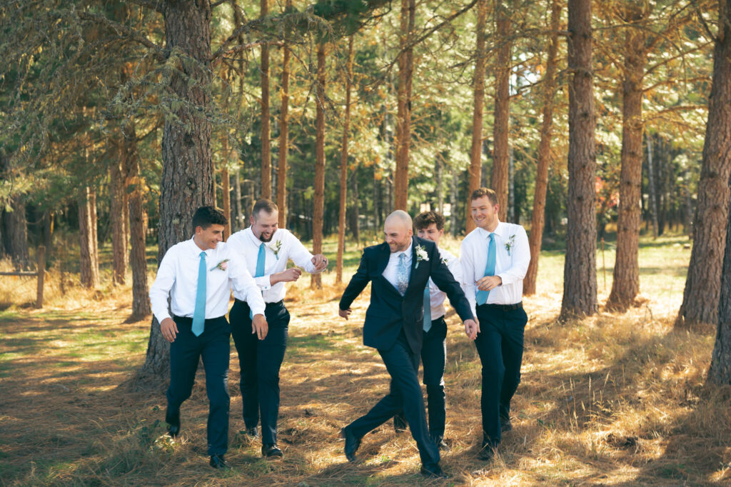 groomsmen messing around with groom before ceremony