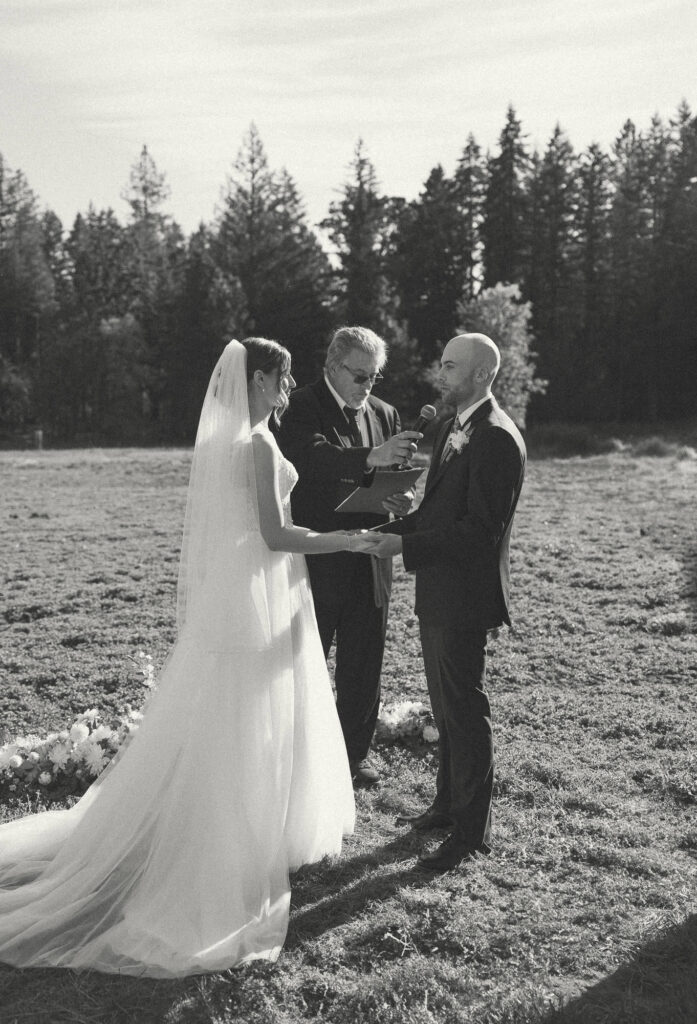 the groom saying his vows during his oregon wedding