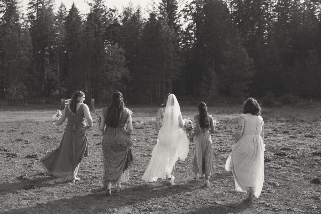 documentary photo of bridesmaids walking away