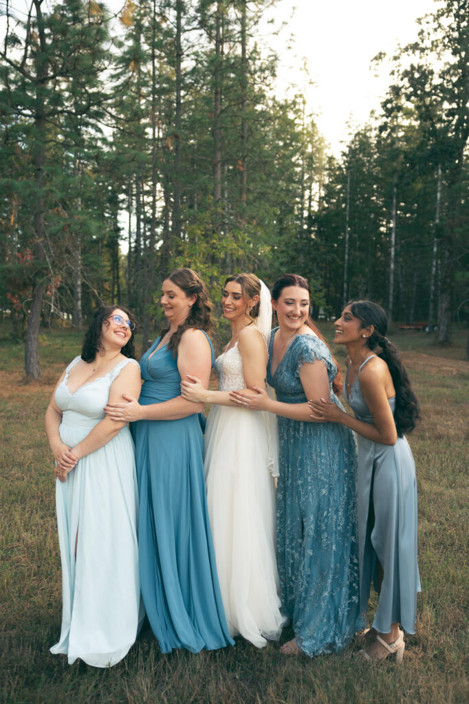 bridesmaids sharing a laugh with the bride