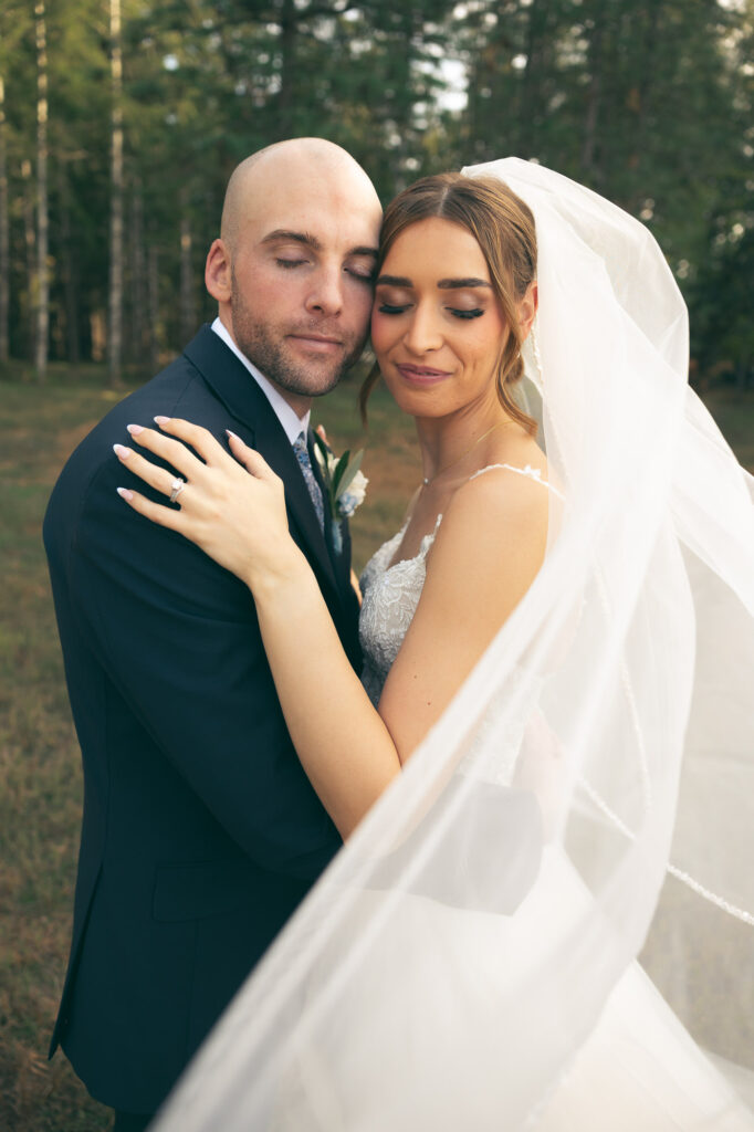 bride and groom with eyes closed, soaking up the moment