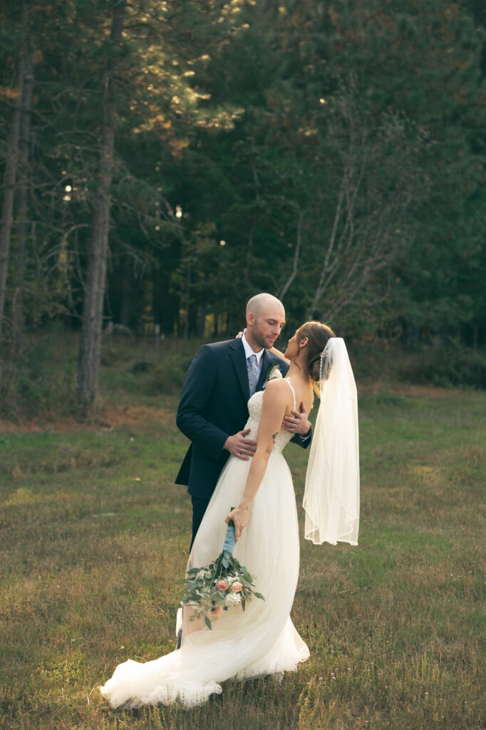 bride and groom portraits in a meadow