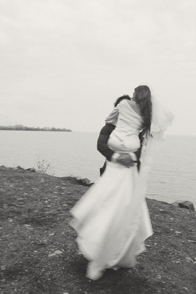 motion blur photo of groom spinning his bride around to evoke emotion