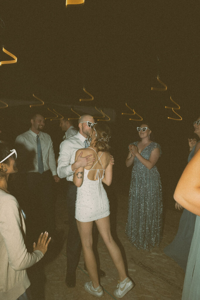 bride and groom sharing a kiss to celebrate their marriage