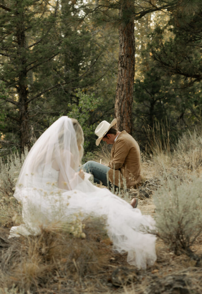 bride and groom writing their vows together in bend, oregon