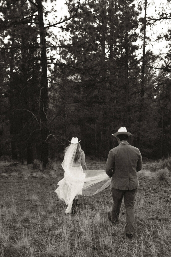 documentary style photo of bride and groom walking away