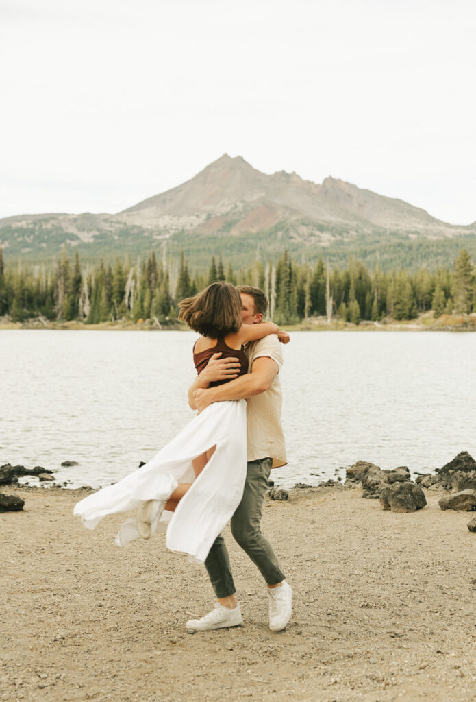 couple spinning around playfully at sparks lake