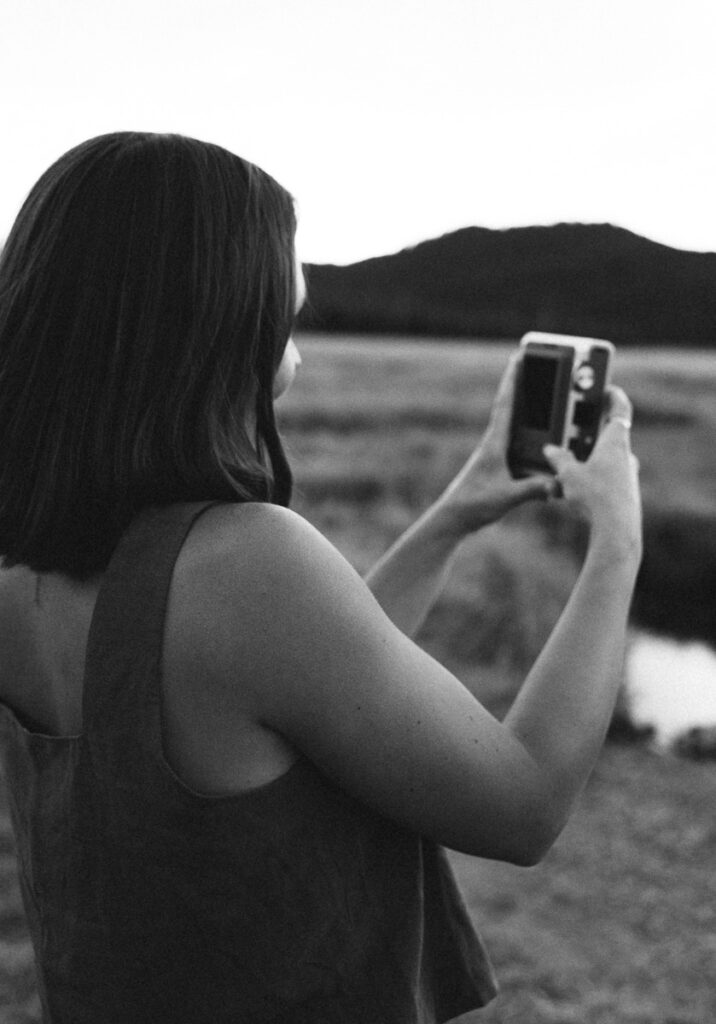 girl taking a picture of her fiance