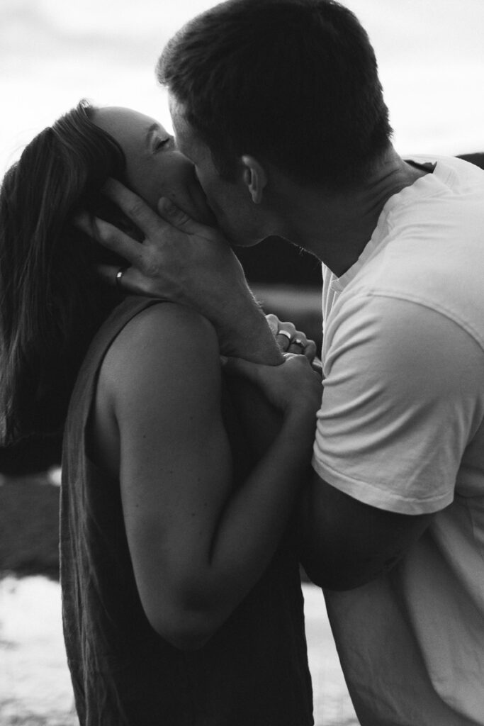 groom kissing his bride all over