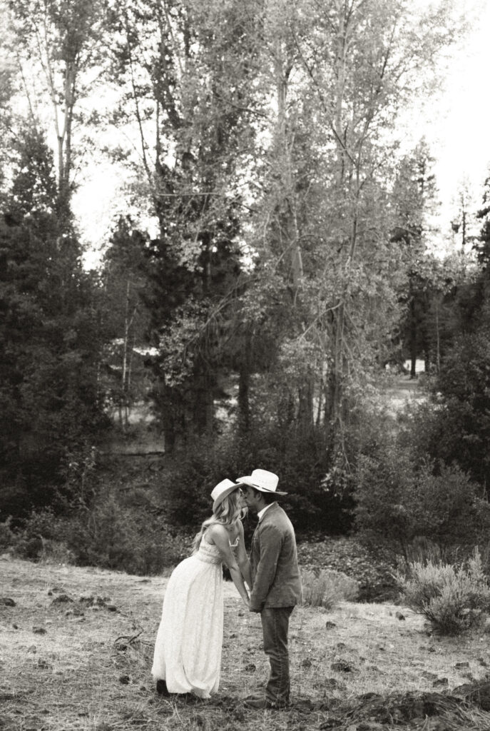 bride and groom kissing during their portraits