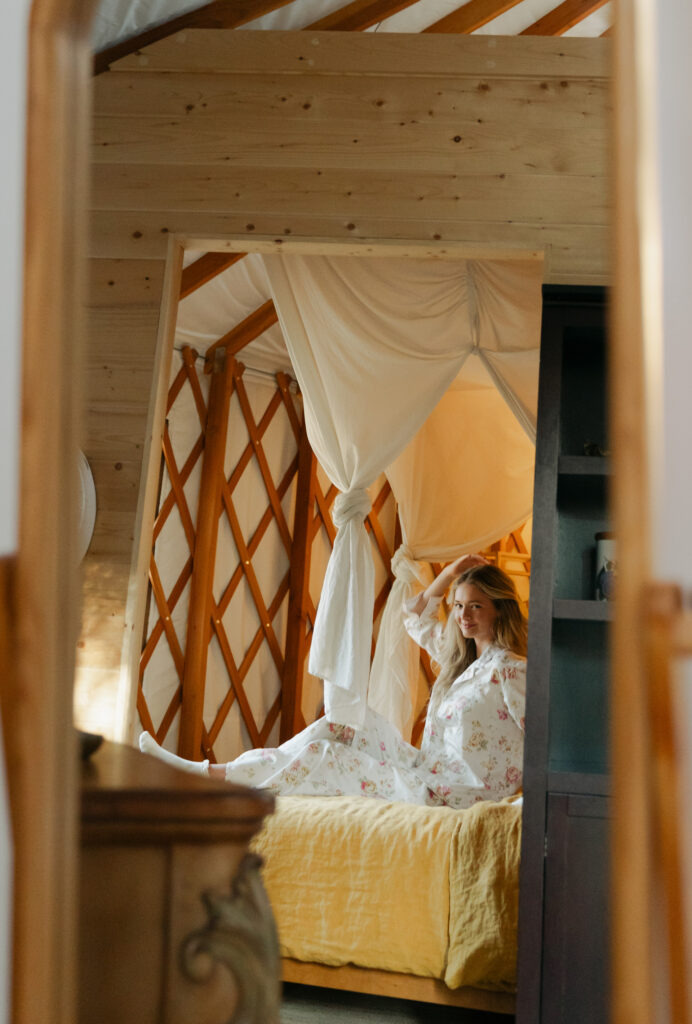 getting ready photo of bride on bungalow bed