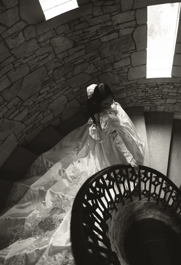 bride walking down spiral staircase