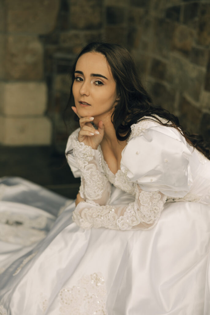 bride looking at camera while sitting down