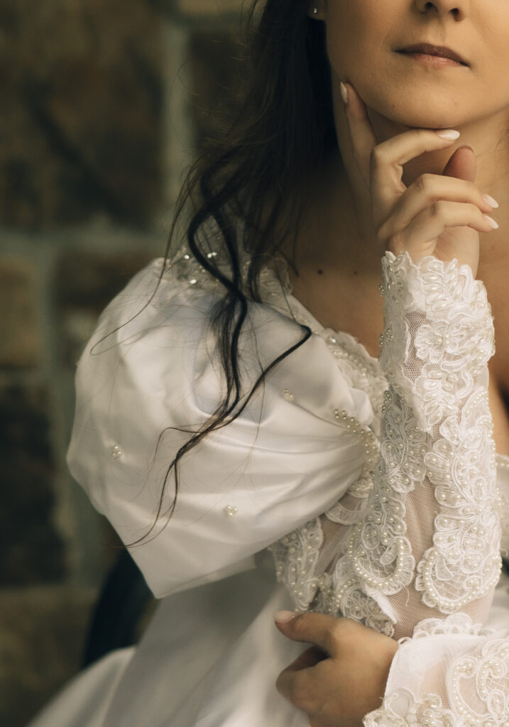 detail photo of bride holding chin