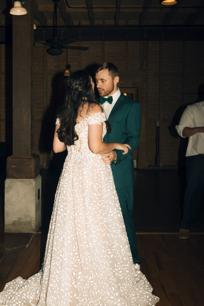 bride and groom slow dancing