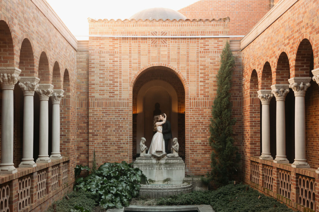 bride and groom in ethereal museum courtyard