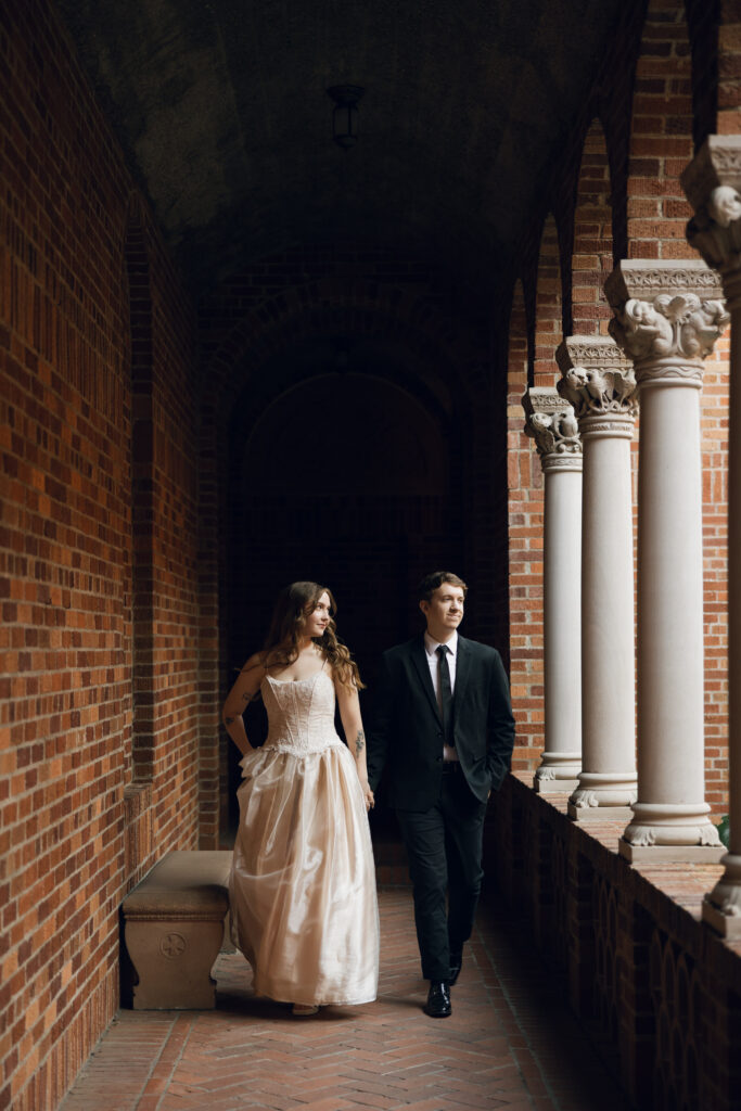 bride and groom walking in walkway