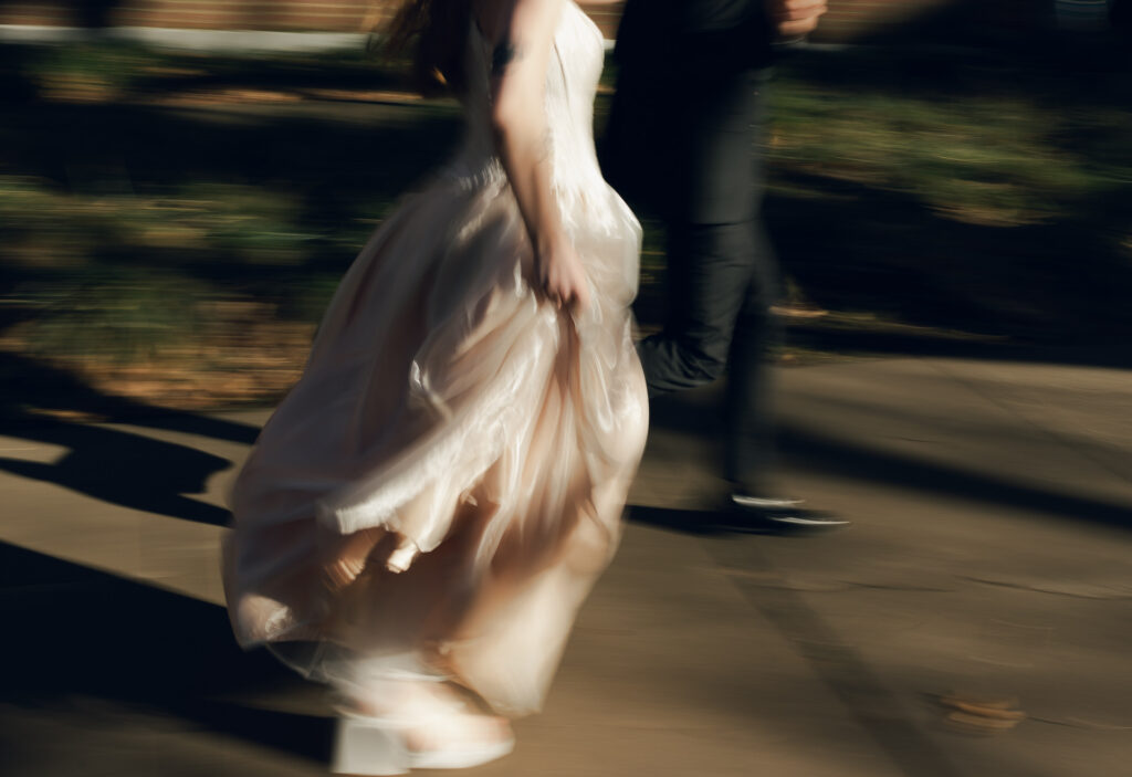 motion blur of bride and groom running