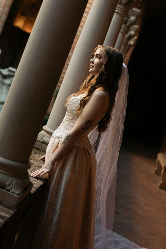 frame tilted, bride looking out from railing