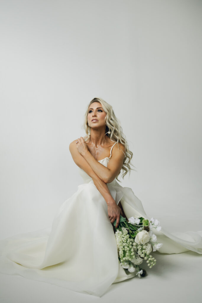 bride squatting and looking into distance