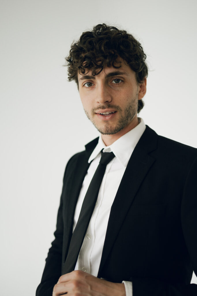 headshot of groom looking at camera