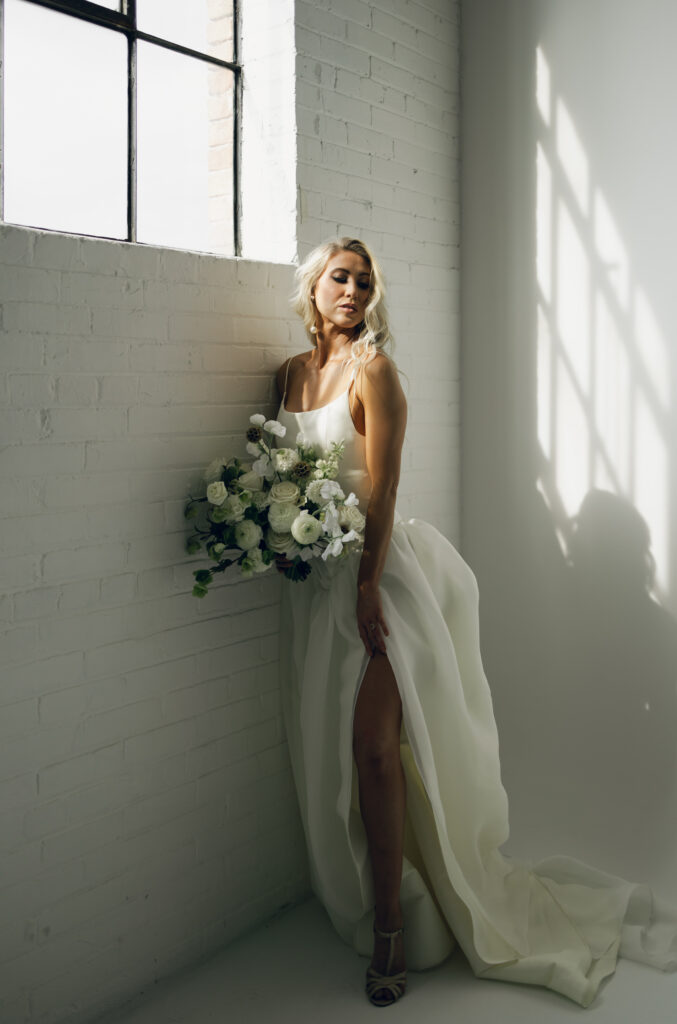 bride leaning on wall