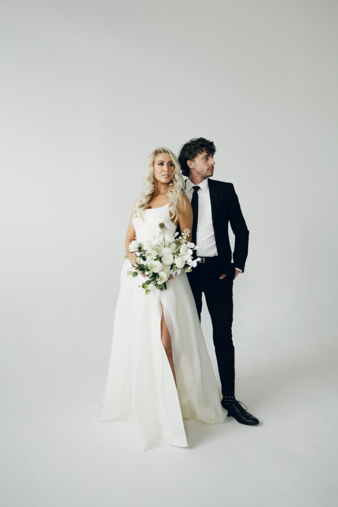 bride and groom posing for editoiral