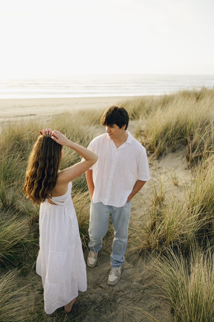 couple talking at oregon coast beach