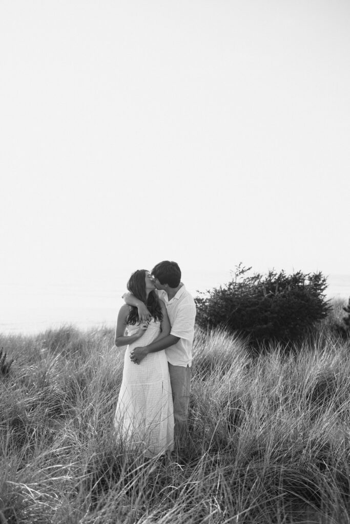 black and white photo of couple kissing during engagement photos