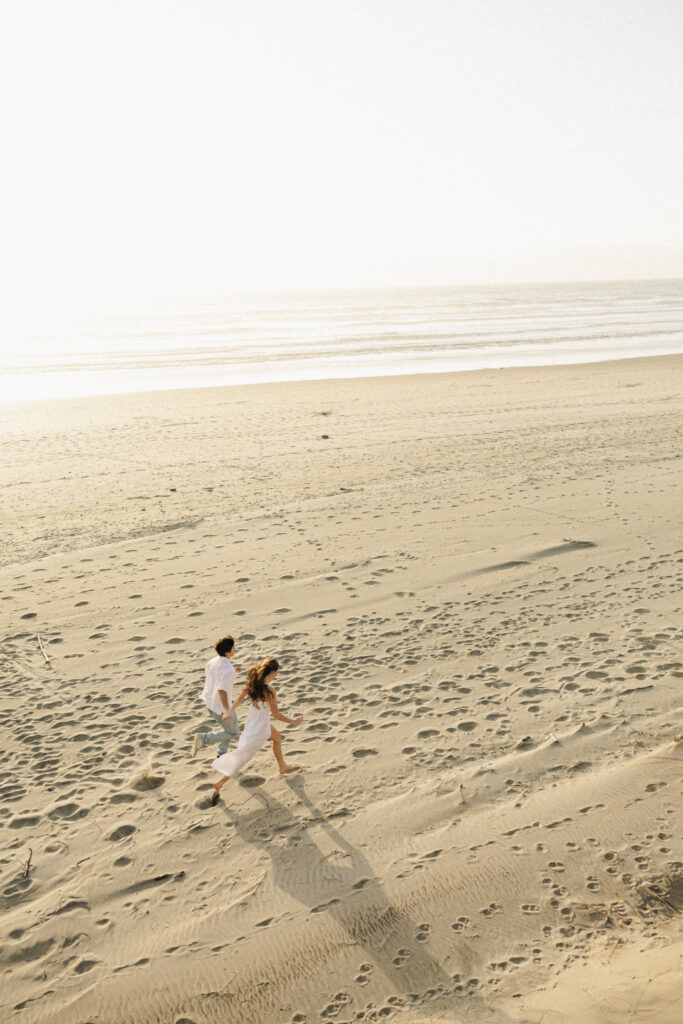 couple running on beach