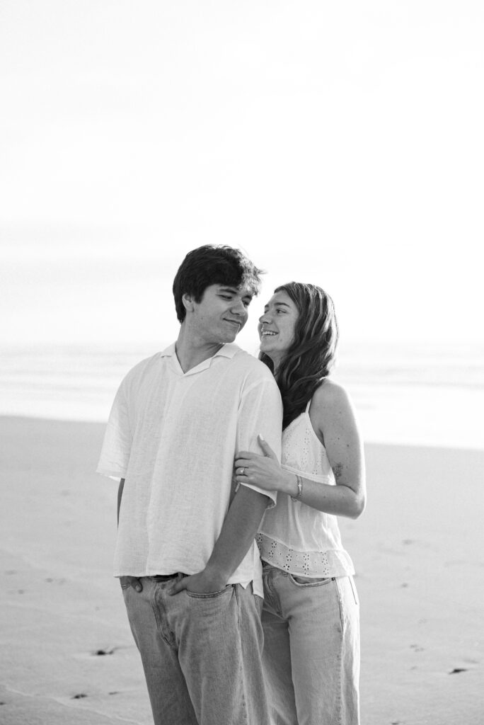 black and white candid photo during beach engagement photos