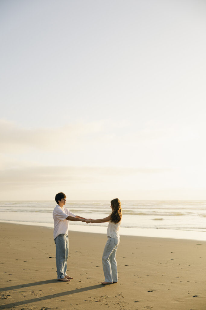 couple swinging on beach