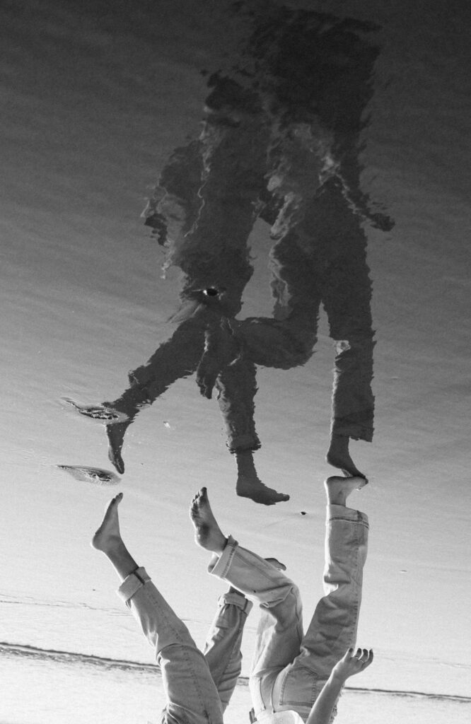 upside down photo of reflection at beach