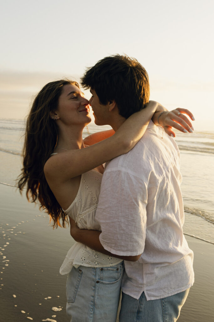 couple embracing each other at beach
