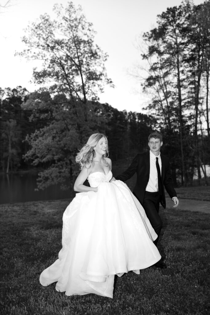 bride and groom walking outside during blue hour