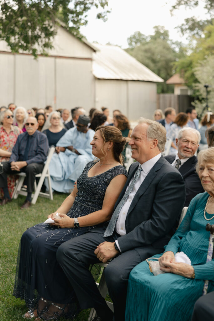 parents smiling during wedding ceremony