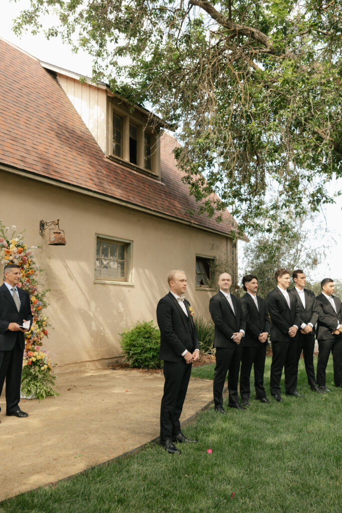 groom waiting for his bride to come down the aisle