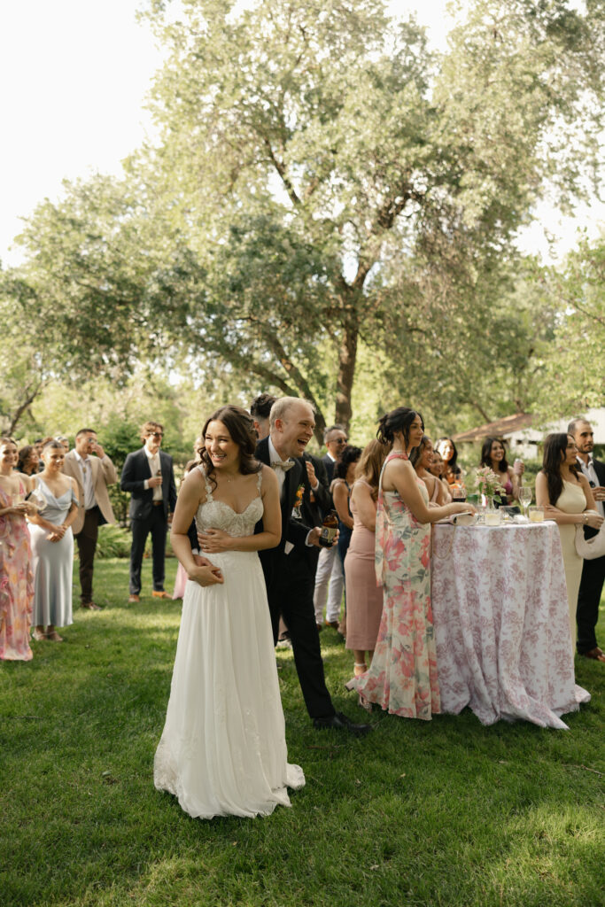 bride and groom laughs during speech