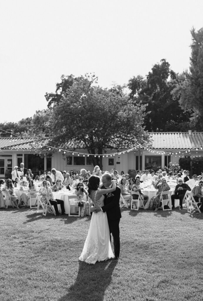 bride and grooms first dance during reception