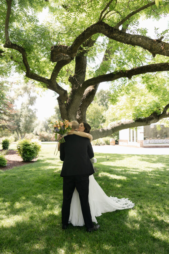 bride and groom embracing after first look