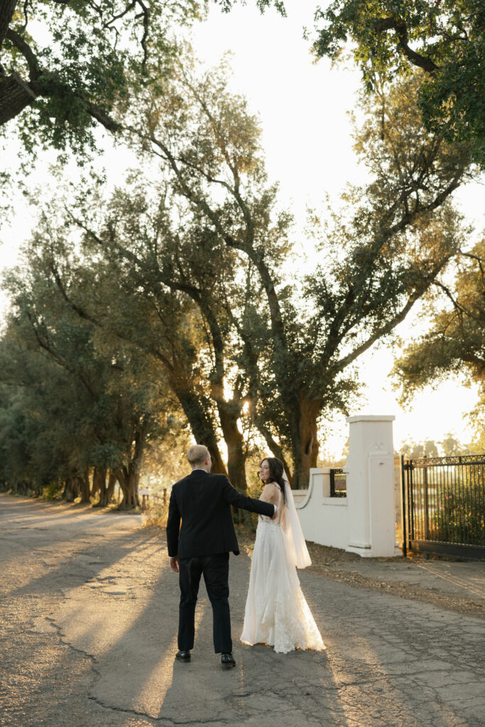 golden hour photos with bride and groom walking