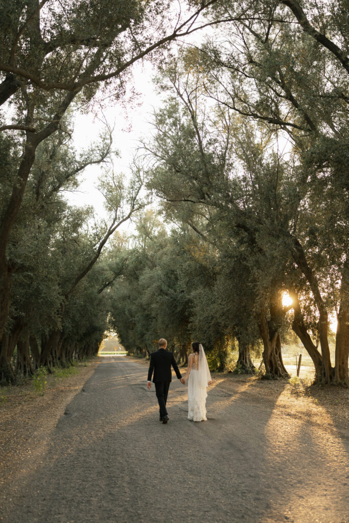 golden hour photos with bride and groom walking