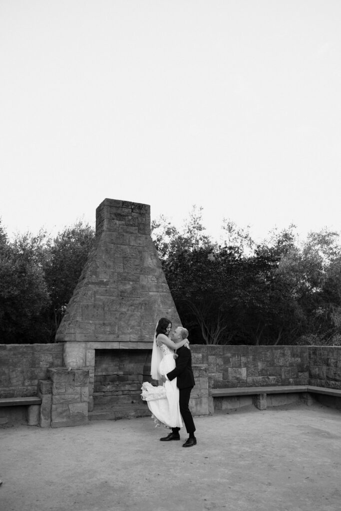 groom picks up bride