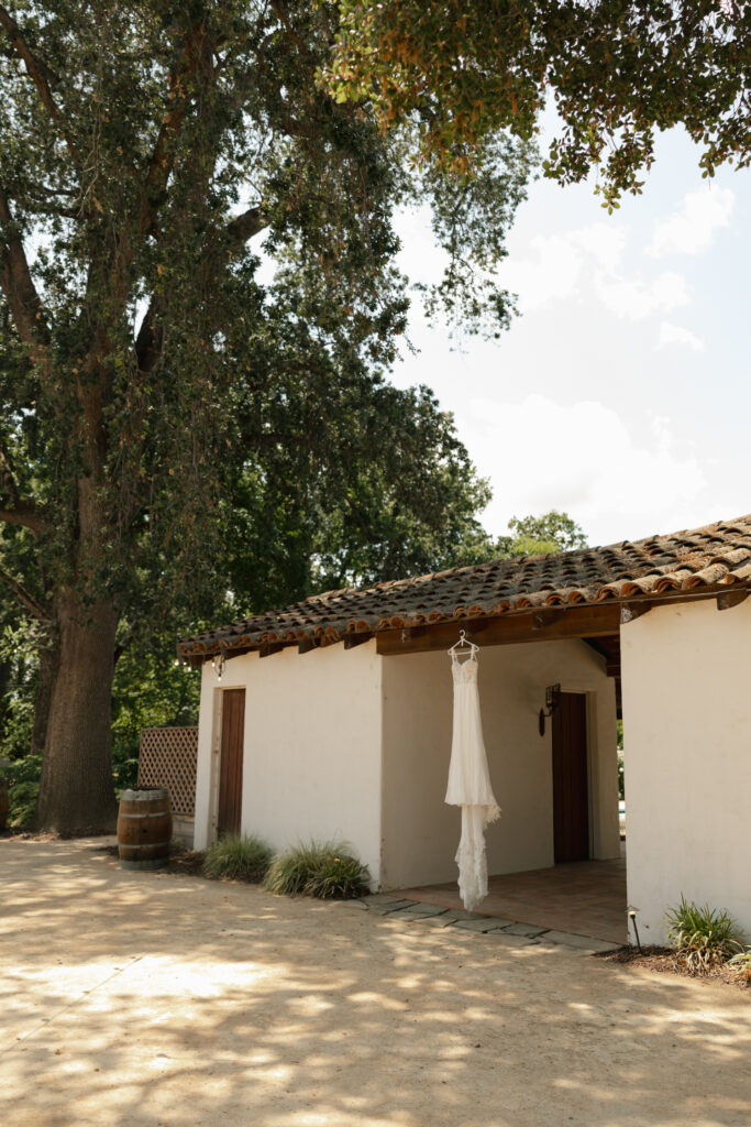 wedding dress hanging from tile roof