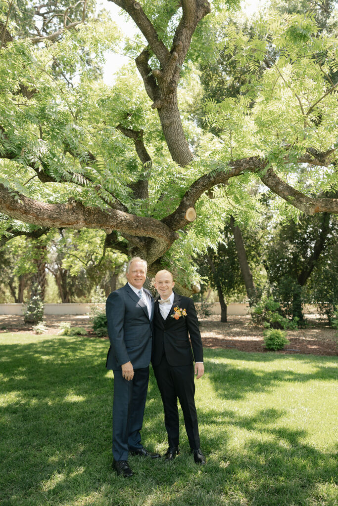 groom smiling with his dad