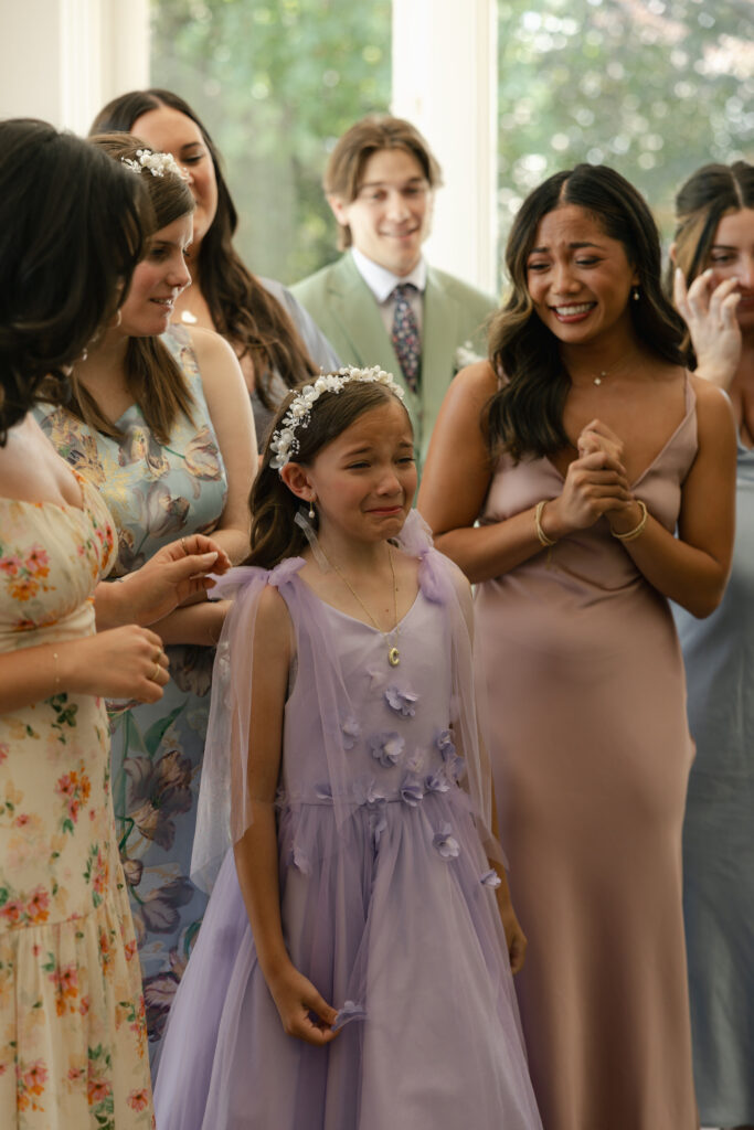 flower girl crying after seeing bride