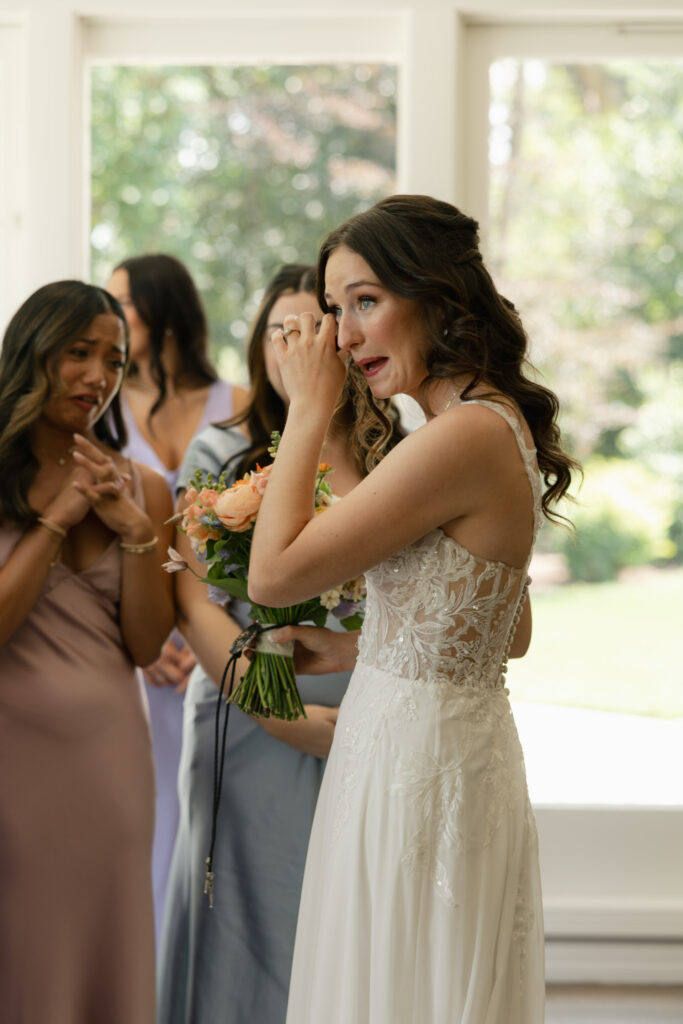 bride crying after first look