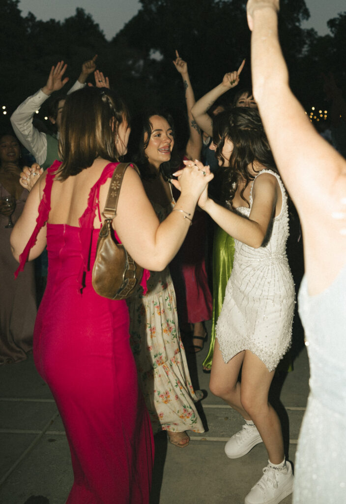 bride dances with friends