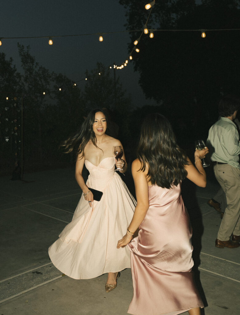 wedding guests spinning on dance floor